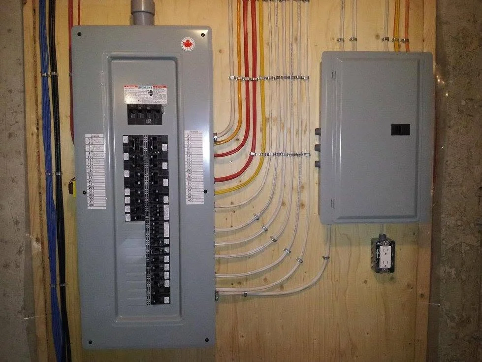 Electrician evaluating a residential electrical panel in an Atlanta home